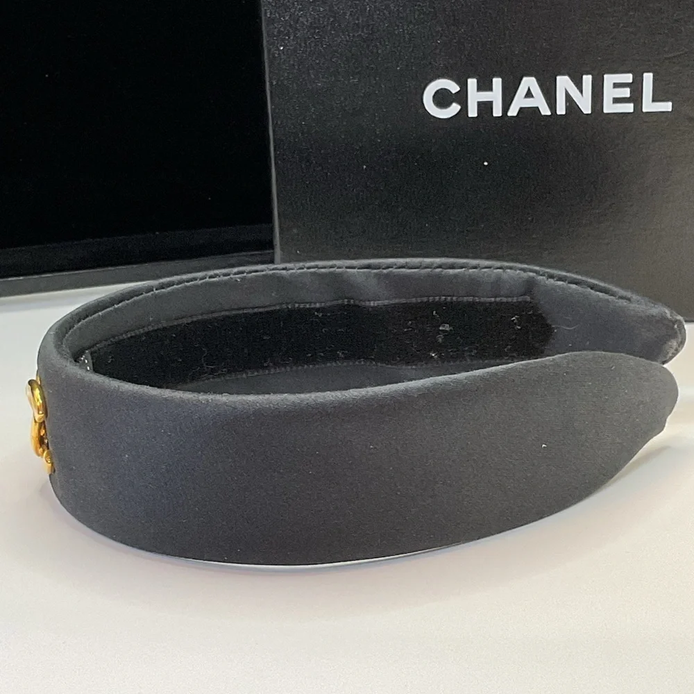 CHANEL Black Headband with Gold Logo Accent